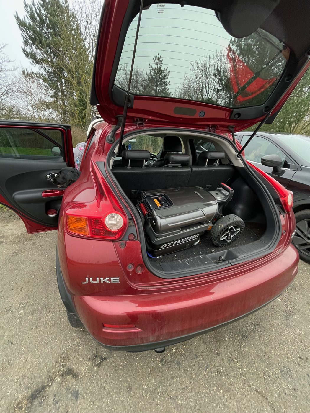 ATTO folding mobility scooter in the boot of a Nissan Juke AWD crossover