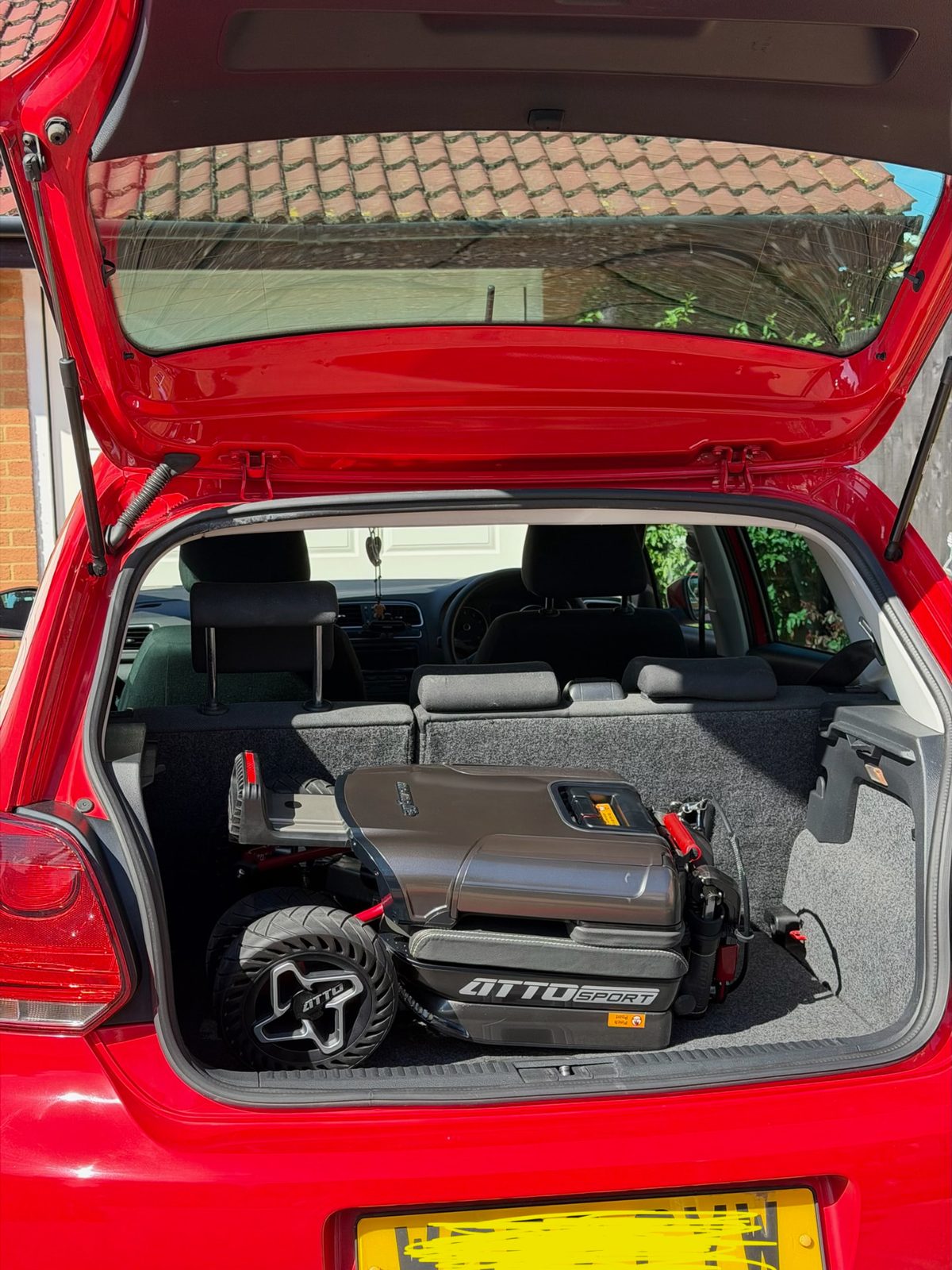 Volkswagen Polo (2009–2014) boot with a folded ATTO mobility scooter ATTO folding mobility scooter in the boot of a 2012 Volkswagen Polo