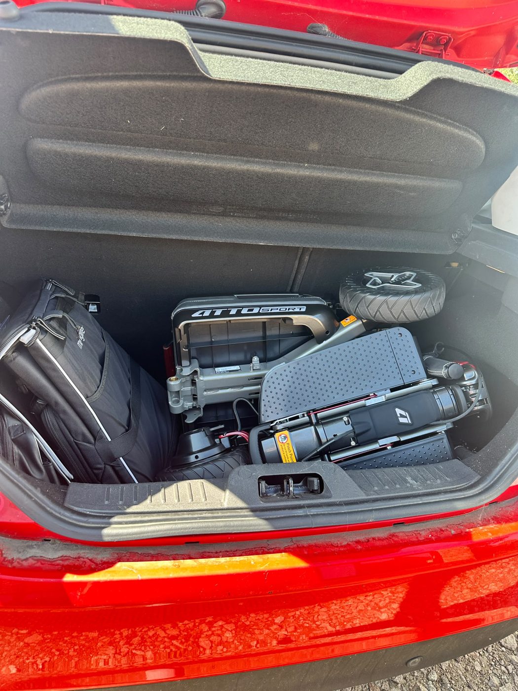 ATTO folding mobility scooter folded in the boot of a Ford Fiesta hatchback - fits with the rear seats up