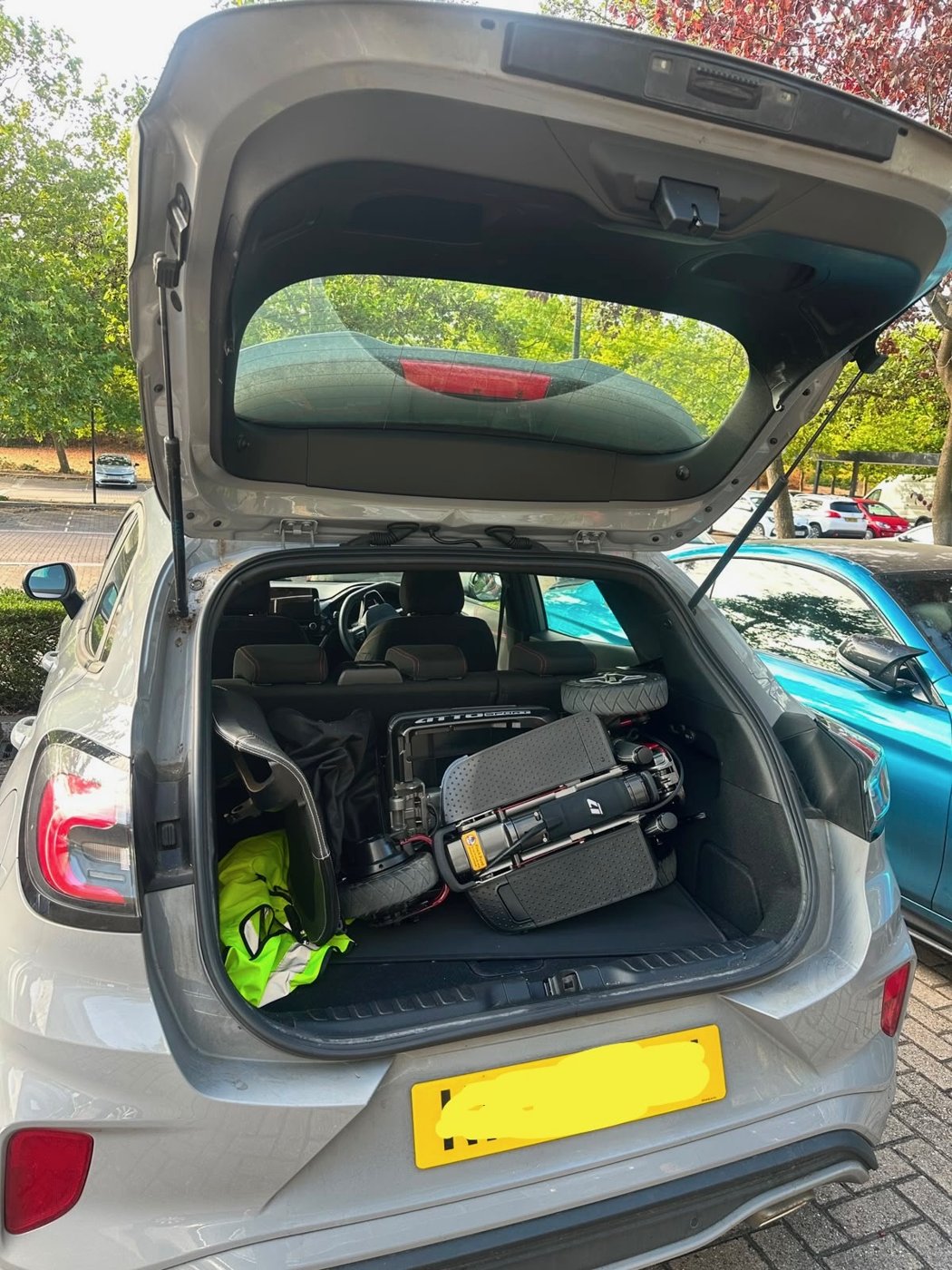 ATTO Sport folding mobility scooter loaded whole in the boot of a Ford Puma