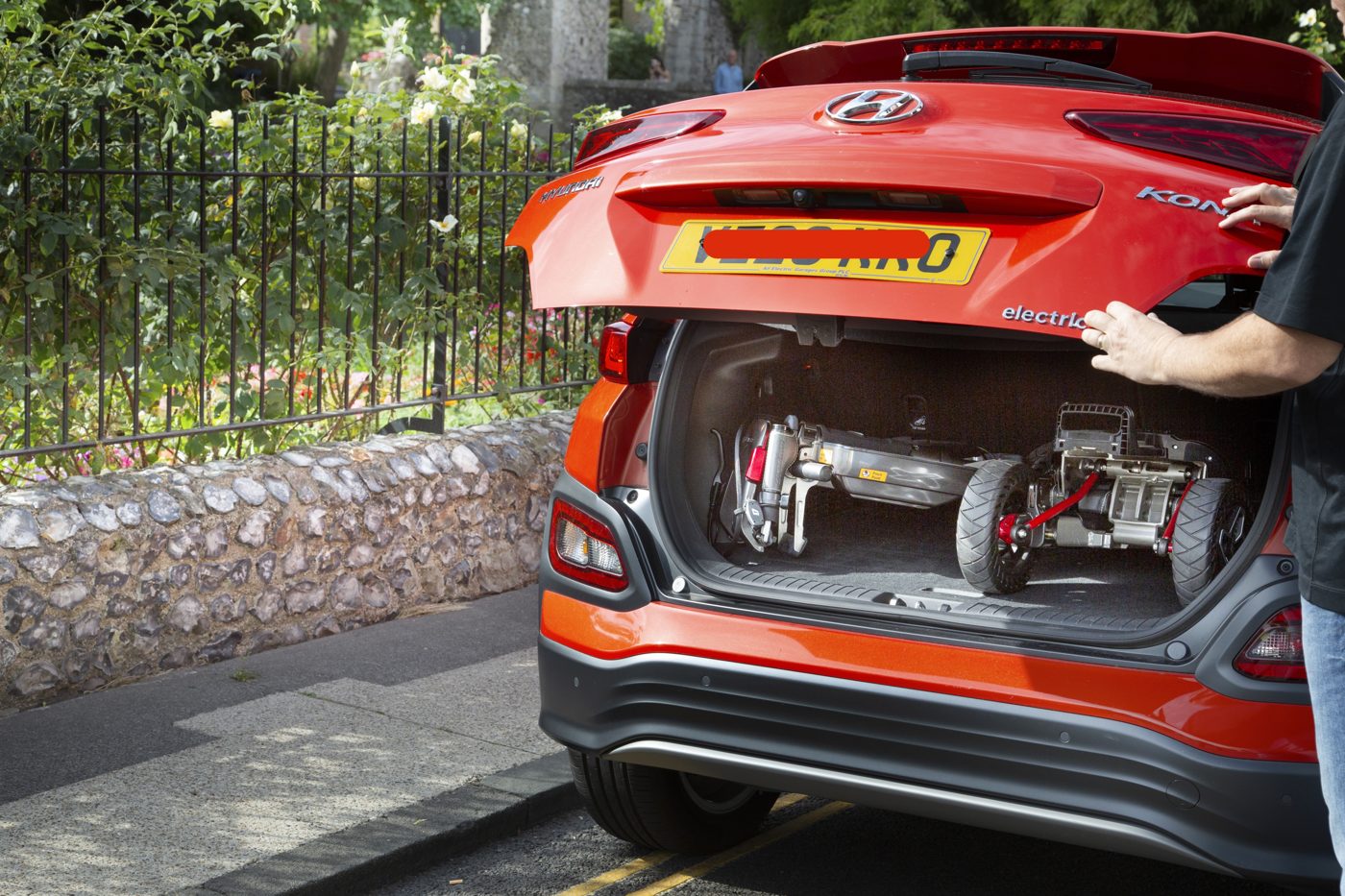 ATTO folding mobility scooter in the boot of a Hyundai Kona Electric SUV
