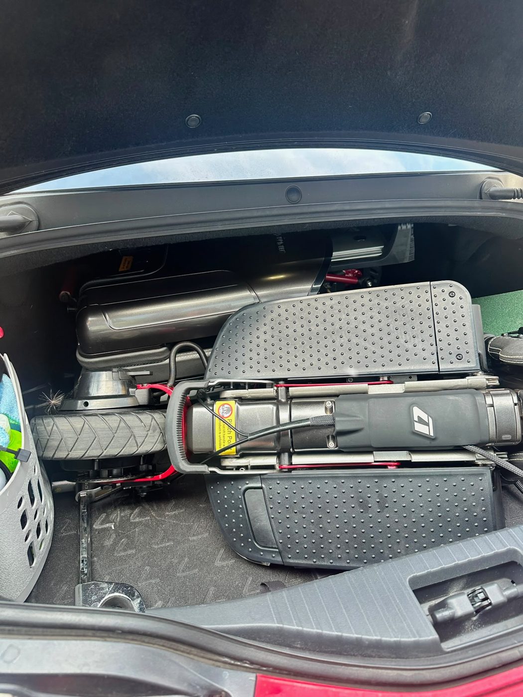 ATTO folding mobility scooter in the boot of a Lexus LC 500 coupe