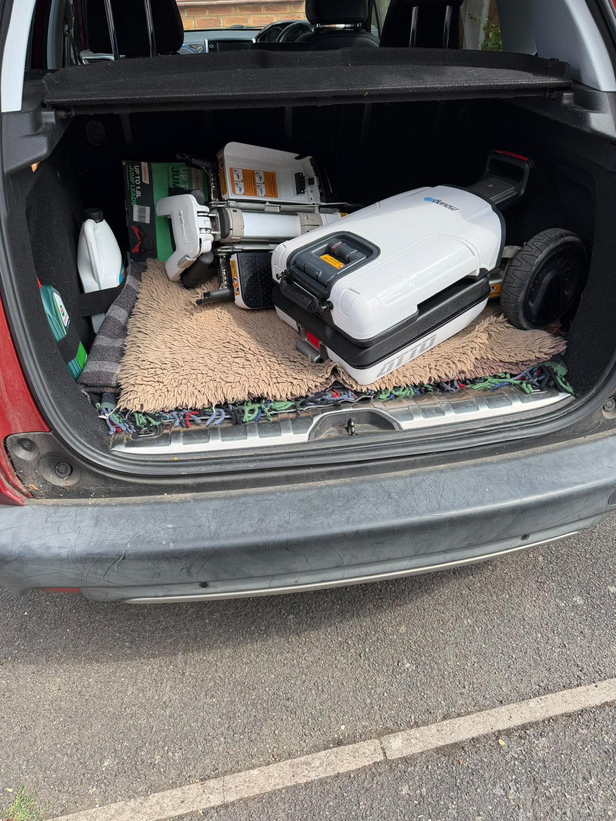 Folded ATTO folding mobility scooter in the boot of a 2014 Peugeot 2008